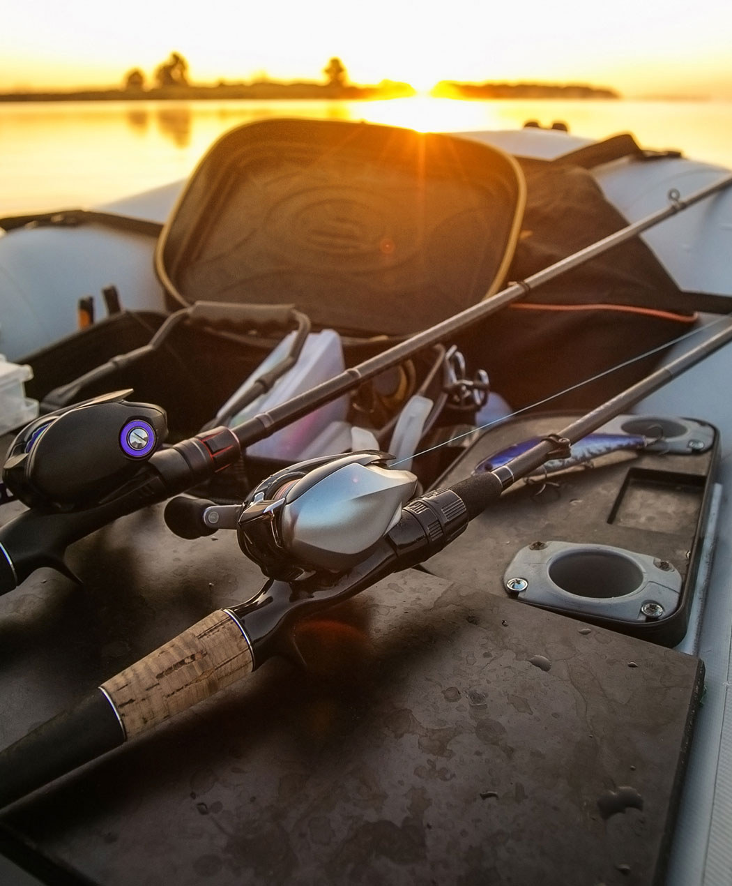 fishing equipment on a boat deck at sunset